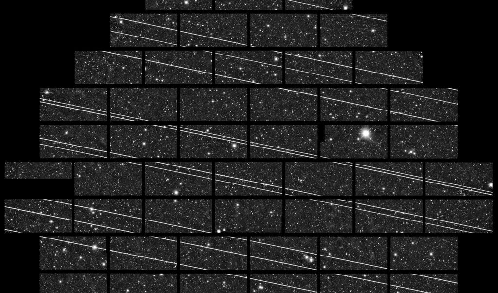 <p>Negentien passerende Starlink satellieten (de streepjes) tijdens een opname van 333 seconden door een telescoop in het noorden van Chili.</p> (beeld ctio )