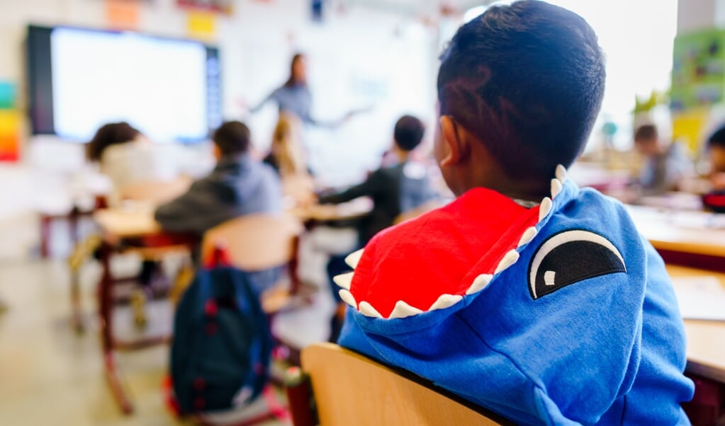 Geen school, veel zieke mensen en onzekerheid. Hoe praat je nu met kinderen over God? (beeld anp / Marco de Swart)