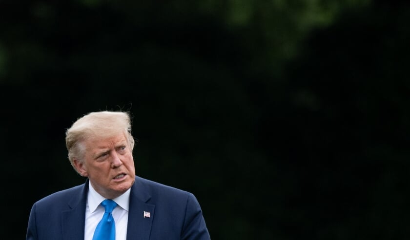 2020-07-12 00:35:28 US President Donald Trump walks from Marine One after arriving on the South Lawn as he returns to the White House in Washington, DC, on July 11, 2020, after visiting Walter Reed National Military Medical Center.
SAUL LOEB / AFP (beeld afp / Saul Loeb)