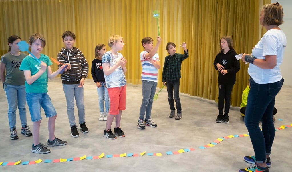 Ook kinderen deden mee aan de gesprekken over het aanpassen van DNA in embryo's. (beeld Levien Willemse)